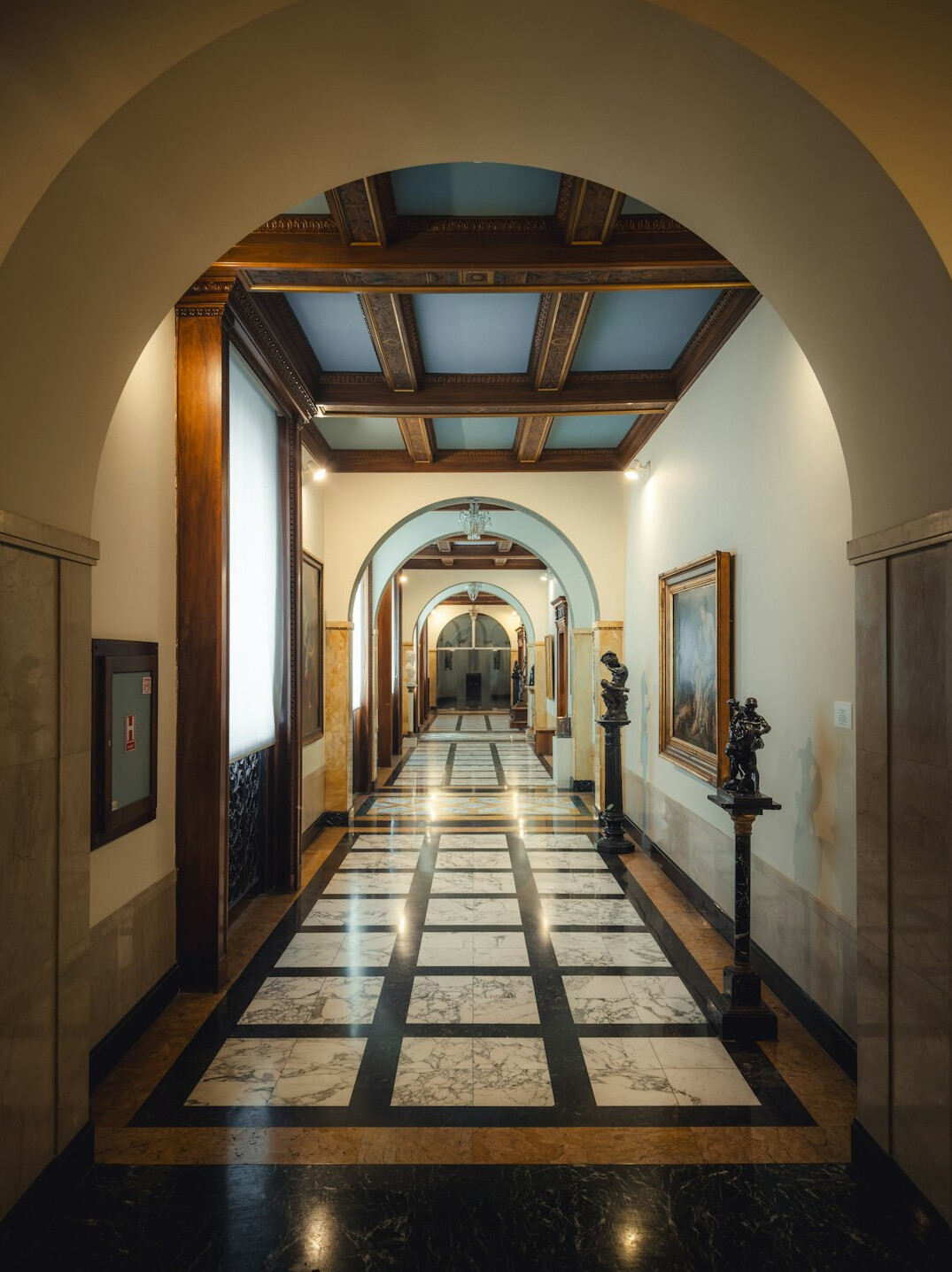 Empty museum corridor with soft daylight