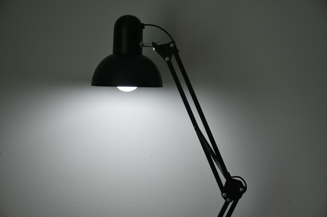 Quiet study desk with lamp and writing materials