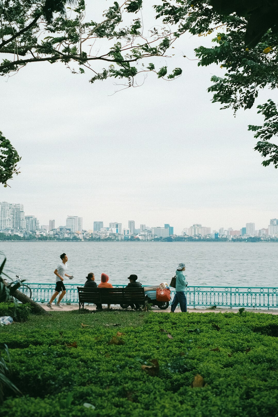 group of friends chatting in city park
