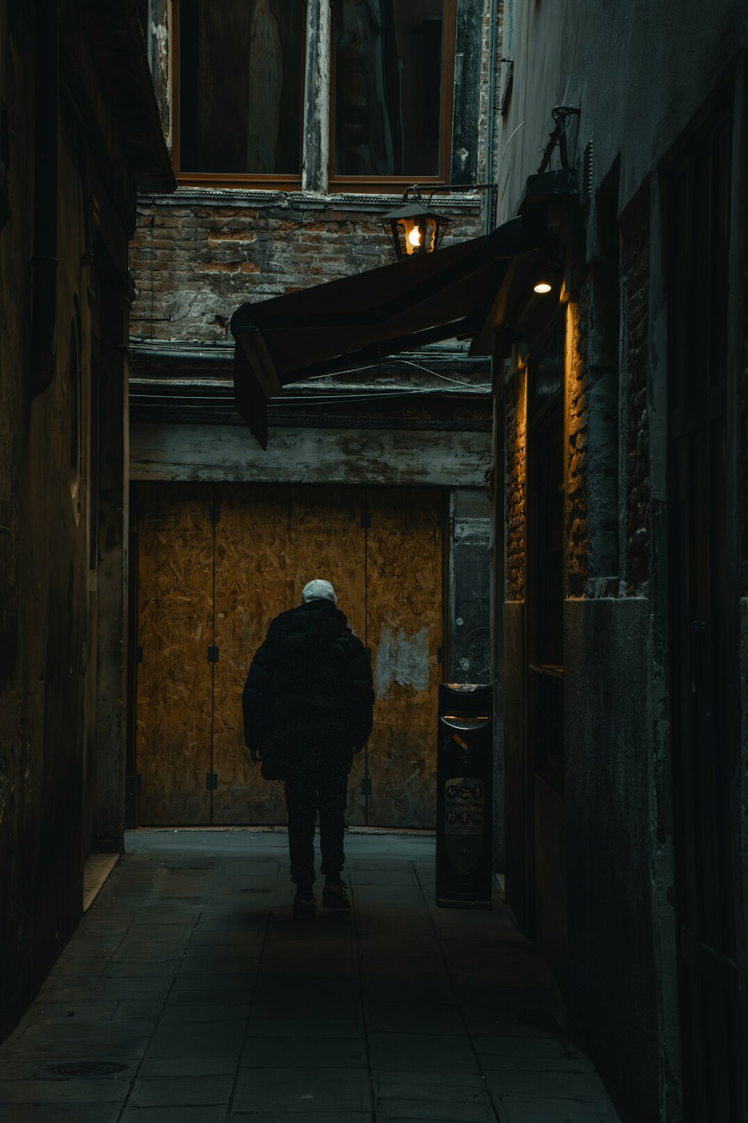 lonely person walking in city street