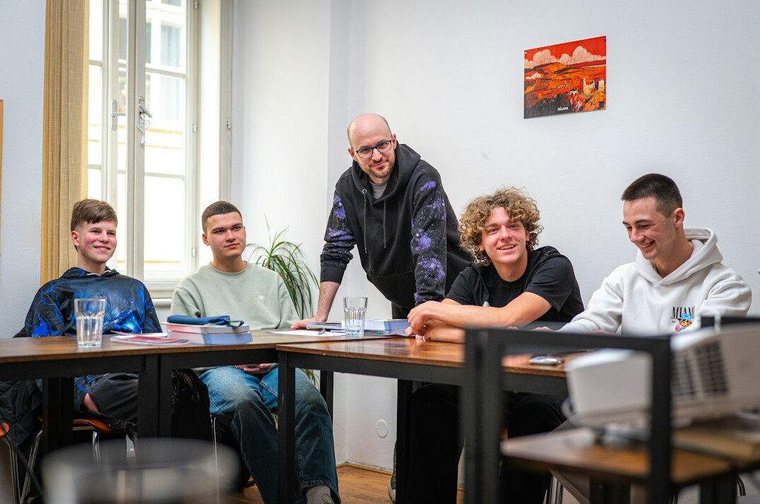 people discussing theories in a room