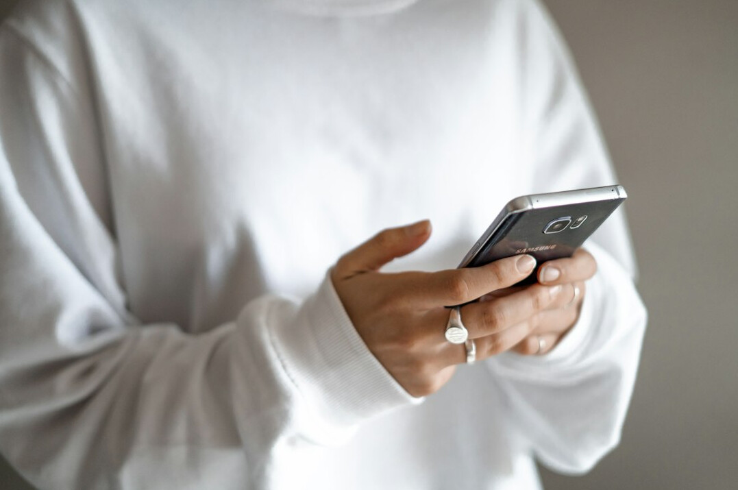 person scrolling on phone