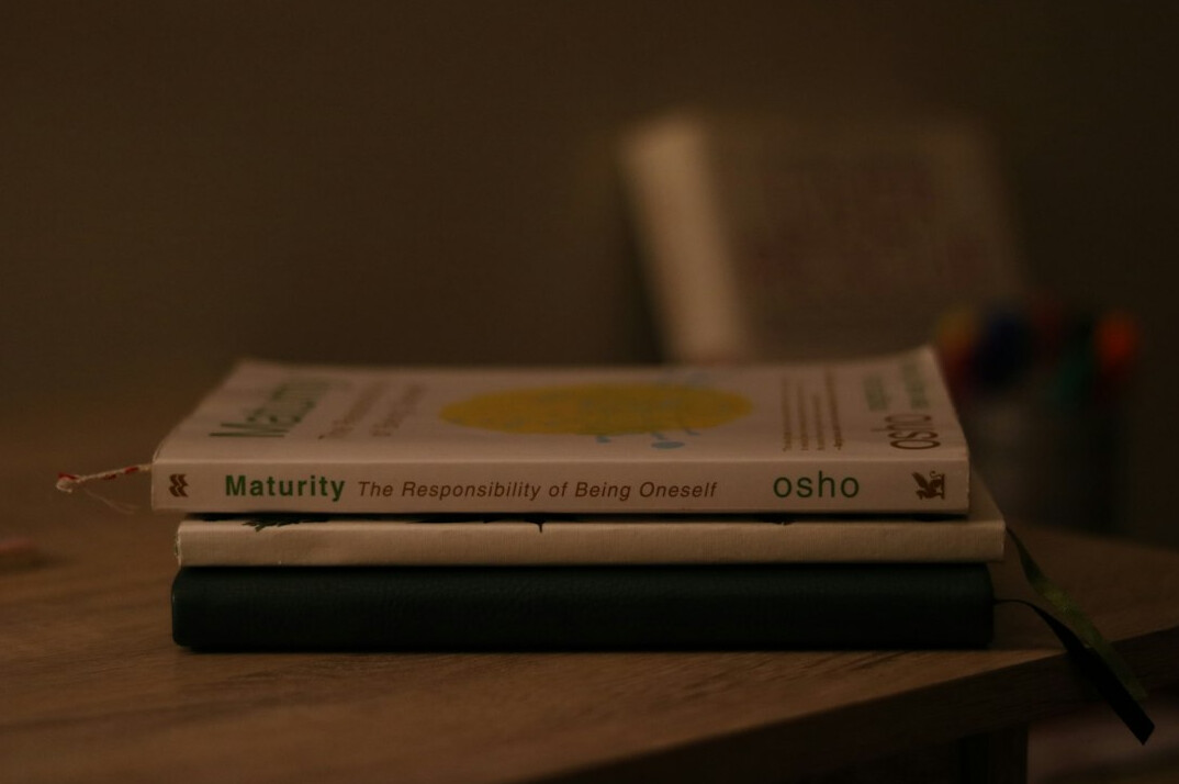 Stack of academic journals and magazines on a desk