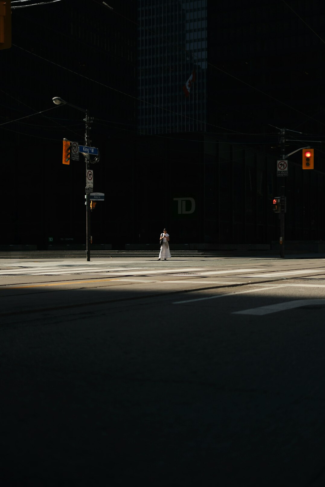 lonely person walking in city street