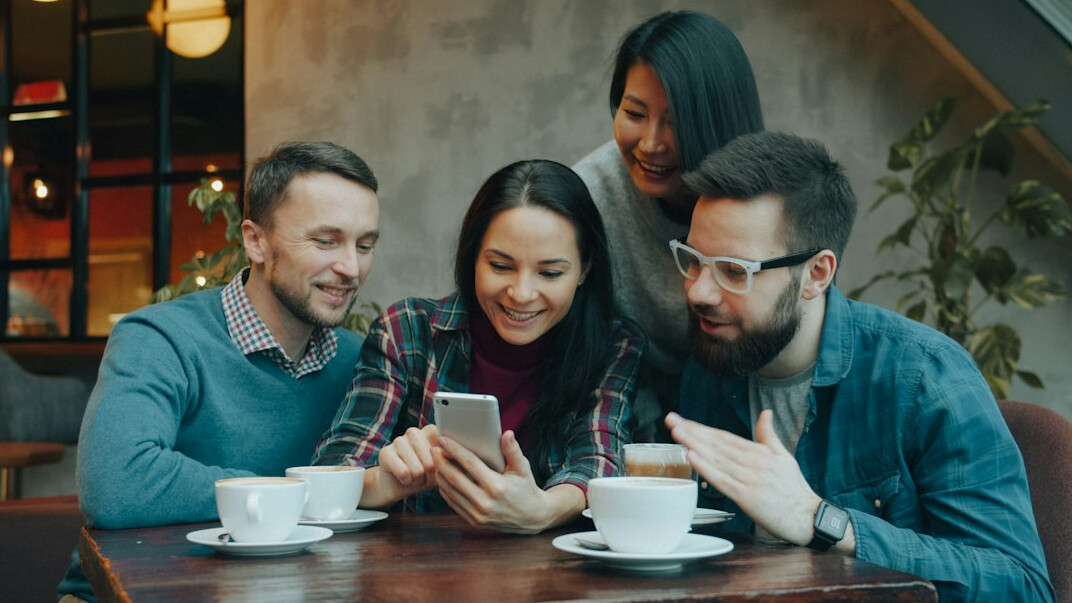 group of friends on phones